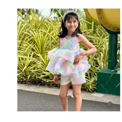 Our favorite little girl looking absolutely lovely in the Rainbow Co-ord set. It's the perfect outfit for an outdoor party, combining high style with the comfort to run and play.