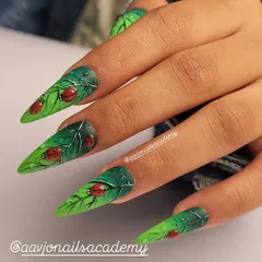 This is where nail art becomes storytelling. For my monsoon series, I created these stiletto nails with detailed, hand-painted green leaves, complete with tiny ladybugs and realistic 3D water droplets, bringing a touch of nature to your fingertips.