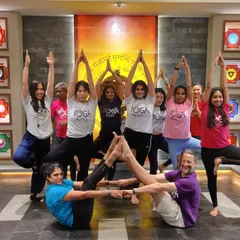 A fun and creative group Acro Yoga pose. We love finding new ways to connect and build together as a community.
