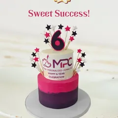 Celebrating six sweet years of success for MPC. This two-tiered cake features a pink and purple ombre design, the company logo, and star toppers to mark the special occasion.