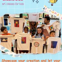 A group of happy artists showcasing their t-shirt creations. This is the best part of my job, seeing the joy when kids get to wear their own designs, from abstract patterns to colorful mandalas.