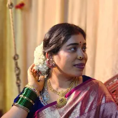 A moment of quiet reflection before a pooja. Adorning my hair with fresh jasmine flowers is a simple act that makes me feel connected to our culture.