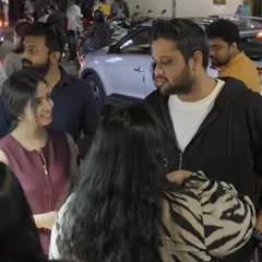 The best moments are the unscripted ones. Here, guests are gathered around the gifting station, chatting and sharing a laugh. Our goal is to create an interactive gifting booth that becomes a natural, happy hub of activity at your event.