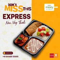 A clear look at our Express Non-Veg Thali. This meal is designed for one person and includes a hearty chicken curry, creamy dal makhani, rice, roti, and a side of fresh salad.