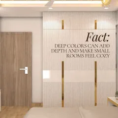 Contrary to popular belief, deep colors can add significant depth and make small rooms feel cozier and more intimate. This bedroom uses textured white and gold wardrobes to balance the space, proving that bold design choices can work wonders in compact areas.