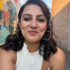 A simple, happy selfie taken in an alley with some cool street art. Just enjoying the day.