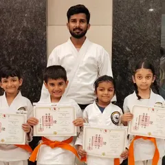 Congratulations to these young orange belt students on their achievement. Posing with their Sensei and their new certificates, they represent the bright future of our dojo.