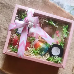 This bridesmaid gift hamper is designed to pamper. It includes a custom name soap, body wash, body lotion, bath salts, and other treats, all elegantly arranged in a pink gift box.