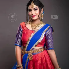 This vibrant half-saree and the matching temple jewellery set are both available for rent. It's a complete look, ready for your special occasion.