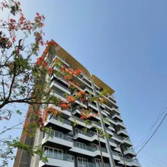 The facade of the 'Nanda Hi-Life' residential tower showcases our love for creating modern art through architecture. We used a rhythmic composition of glass and solid mass with brick textures to give this ultra-luxurious building its distinctive, plush look.