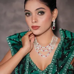 A close-up portrait of the finished glam look, showing the flawless skin and striking eye makeup.