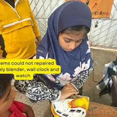 A young girl carefully repairs a football during our Hyderabad workshop. We teach that repair is not limited to electronics or clothes; even sports equipment can often be fixed with a little ingenuity.