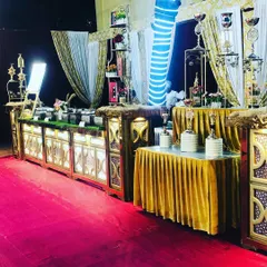 Another perspective of the engagement dinner setup, highlighting the grand scale and cohesive gold and white theme. We use decorative elements and tiered displays to add height and visual interest.