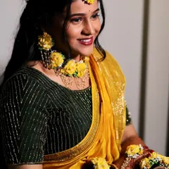 Another beautiful shot from the Haldi ceremony. The bride's smile is infectious, and her makeup is designed to last through all the fun and rituals.