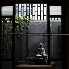 I believe a garden should bring peace that extends into your home. This view from inside shows how we can create a tranquil courtyard, featuring a serene Buddha statue and natural stone, turning your window into a living piece of art.