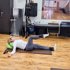 Here is a client performing a gentle leg exercise on the mat with ankle weights. We focus on slow, controlled movements to build strength without putting any strain on the joints.