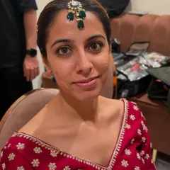 Before the final look, this is bride Kritika. My pro tip for brides with textured skin is to always consider airbrush makeup. You can see the magical, skin-like finish it provides in the final photos.