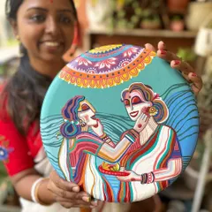 This plate from the set captures the playful tradition of Sindoor Khela, where women apply vermilion to each other on the last day of Durga Puja.