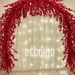 For a festive occasion like Ganesh Chaturthi, I created this stunning arch using bold red flowers. Set against a backdrop of white curtains and fairy lights, it creates a simple yet impactful and reverent atmosphere.
