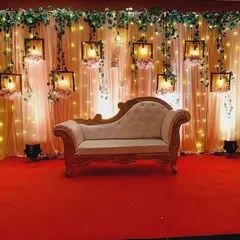 This elegant ring ceremony stage creates a warm and intimate atmosphere. The design features a backdrop of soft fairy lights and beautiful hanging lanterns, perfect for a sophisticated engagement party in Mumbai.