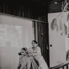 A mother helping her daughter get ready. These quiet, behind-the-scenes moments are just as important as the main ceremony.