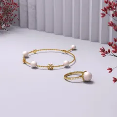 Gift her the beauty of love with Mother of Pearl and diamonds that shine as bright as she does. This 'Pieces of You' collection, featuring a pearl bracelet and ring, is a tribute to her beauty and grace.