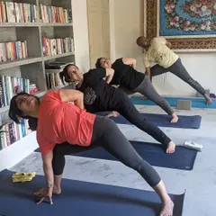 A look inside one of our group yoga classes during a retreat. Here, students are exploring a variation of Parsvakonasana, or Side Angle Pose, finding strength and openness. The collective energy of practicing together is so powerful.