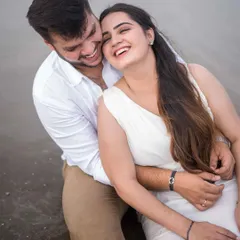 Even on an overcast, rainy day in Goa, the laughter doesn't stop. This cozy, happy moment from a beach session shows that beautiful photos aren't about perfect weather, but about the warmth and connection you share.