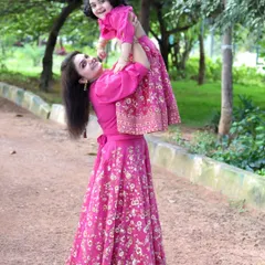 Flying high with mom. The open spaces in Bengaluru's parks are perfect for these fun, interactive shots that show your family's love and connection.