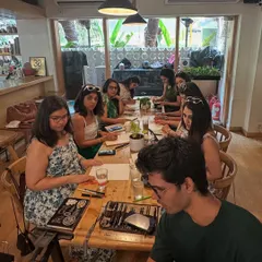 A full view of a birthday party workshop I hosted. The cafe setting provides a cozy and inspiring atmosphere for creating art.