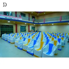 For larger gatherings or corporate functions, I can arrange for seating with chair covers that match your event's color scheme. Here, I used white covers with blue and yellow sashes.