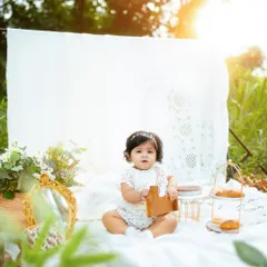 Celebrating a first birthday with a golden hour picnic. These outdoor sessions are so much fun, letting your little one explore while I capture their curious expressions and happy smiles in the warm, dreamy light.
