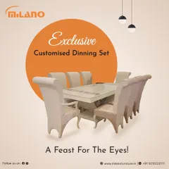 This exclusive customized dining set is a feast for the eyes. It features a high-gloss white finish with classic carved legs and plush upholstered chairs.