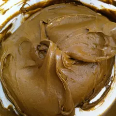 This is what pure, natural henna paste looks like. It has a thick, pudding-like texture that holds its shape, which is perfect for creating raised designs that stay in place as they dry.