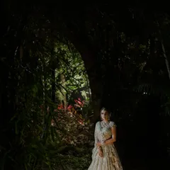 A bride illuminated in the darkness, like a character in a fairy tale. I love creating dramatic, cinematic portraits that tell a story and highlight the bride's magnificent presence.
