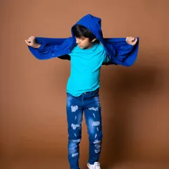 A playful shot for a kids' clothing lookbook. Capturing movement and personality is key to successful kids' fashion photography.
