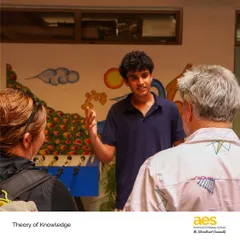 A student passionately discusses his TOK exhibition with members of our community. The event is a showcase of critical thinking and the ability to make connections between academic concepts and the real world.