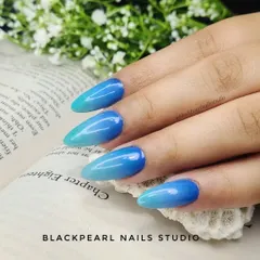 A beautiful blue ombré effect, transitioning from a deep blue to a light sky blue. This gradient gives the nails an ocean-like feel, perfect for a vacation or a pop of color.