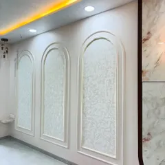 Another wall design, where the POP arches are filled with a subtle, patterned wallpaper, creating a sophisticated and classic look.