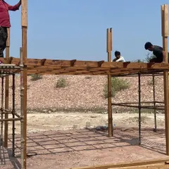 The construction phase of the pergola. My team carefully assembles the main frame and rafters on site, ensuring a precise and secure build.