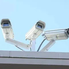 A stock image representing a multi-camera security solution for a business. We design and install custom systems to protect your commercial property.