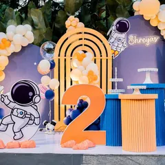 Another angle of the space theme, focusing on the large number '2' and the cute astronaut character sitting on the moon.