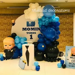Here's another take on the popular Boss Baby first birthday theme. This design uses a bold color palette of royal blue, black, and white, with a custom backdrop and character props for a fun and stylish celebration.
