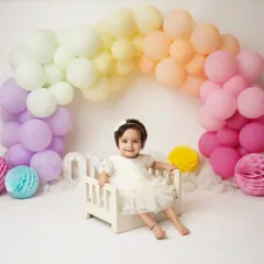 Turning one is a rainbow of emotions, and I love to celebrate it with color and joy. Milestone sessions like this are designed to capture your child's budding personality, from their sweet smiles to their curious glances. This is a perfect way to mark their first big birthday.
