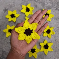 A handful of my sunflower appliques. These can be turned into keychains, earrings, or used in any of your DIY craft projects.