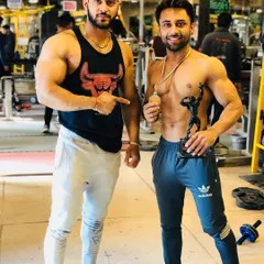 Here I am with another successful client, holding his trophy. My role as a coach is to give you the blueprint; your hard work earns the prize.