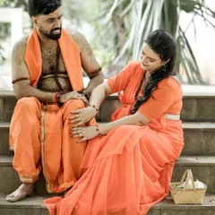 Capturing a playful and loving interaction as part of the traditional Indian maternity concept. The coordinated orange outfits and natural setting enhance the storytelling element of the shoot.