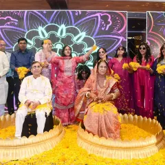 A fun and colorful moment as the couple is showered with flower petals by their family and friends.