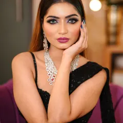 A bold glam look featuring a dramatic smokey eye with a pop of purple and a deep magenta lip. This is perfect for a cocktail party or a night out.