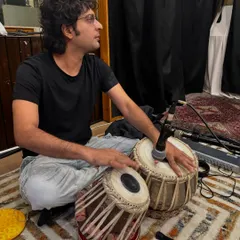 A focused moment during the jam session in Kolkata. You can see the professional microphone setup I use to capture the nuanced sounds of the tabla even in a multi-instrument environment.